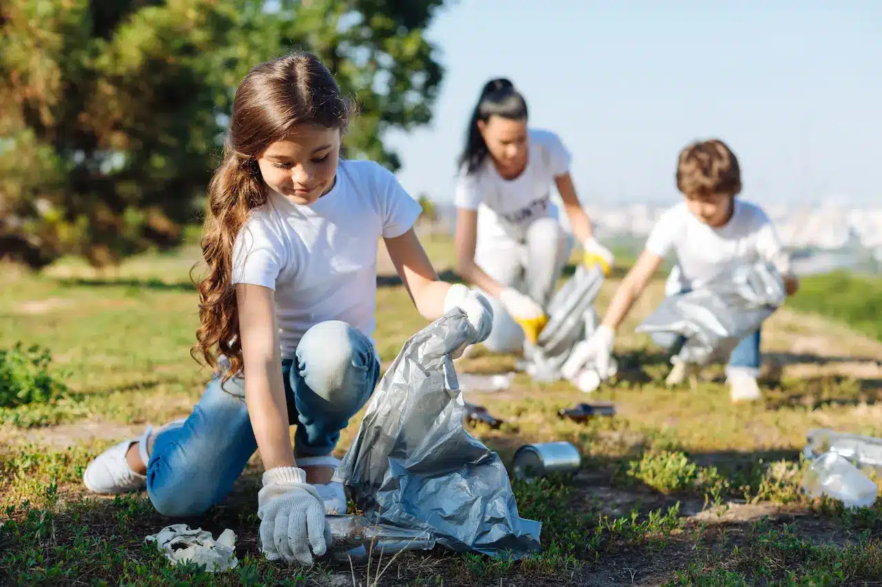 Girls Picking up Trashes on the Ground
