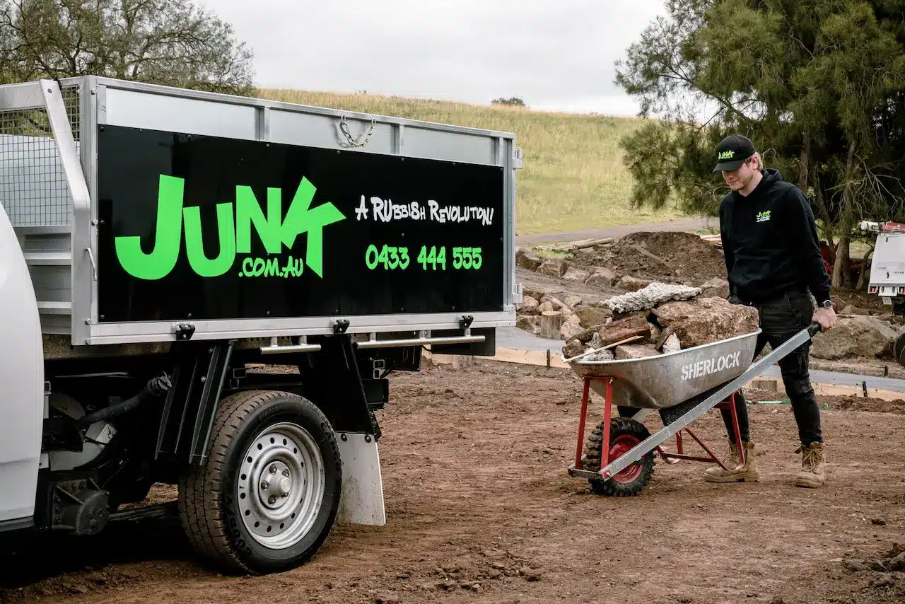 Junk Careers Person Pushing a Wheelbarrow with Stones