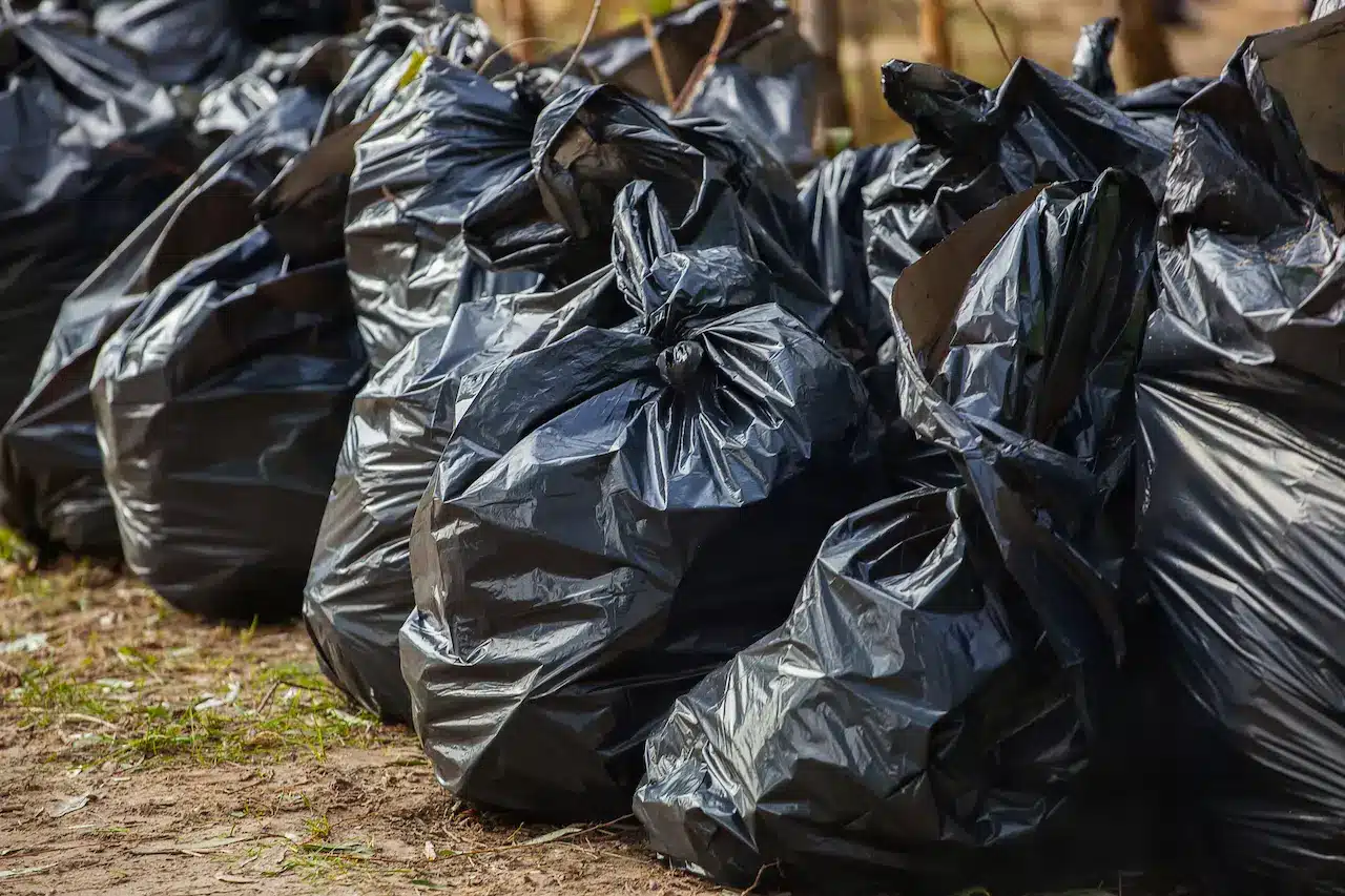 Pile of Trash Bags Outside 